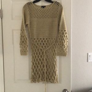 Tan crocheted beach cover up.